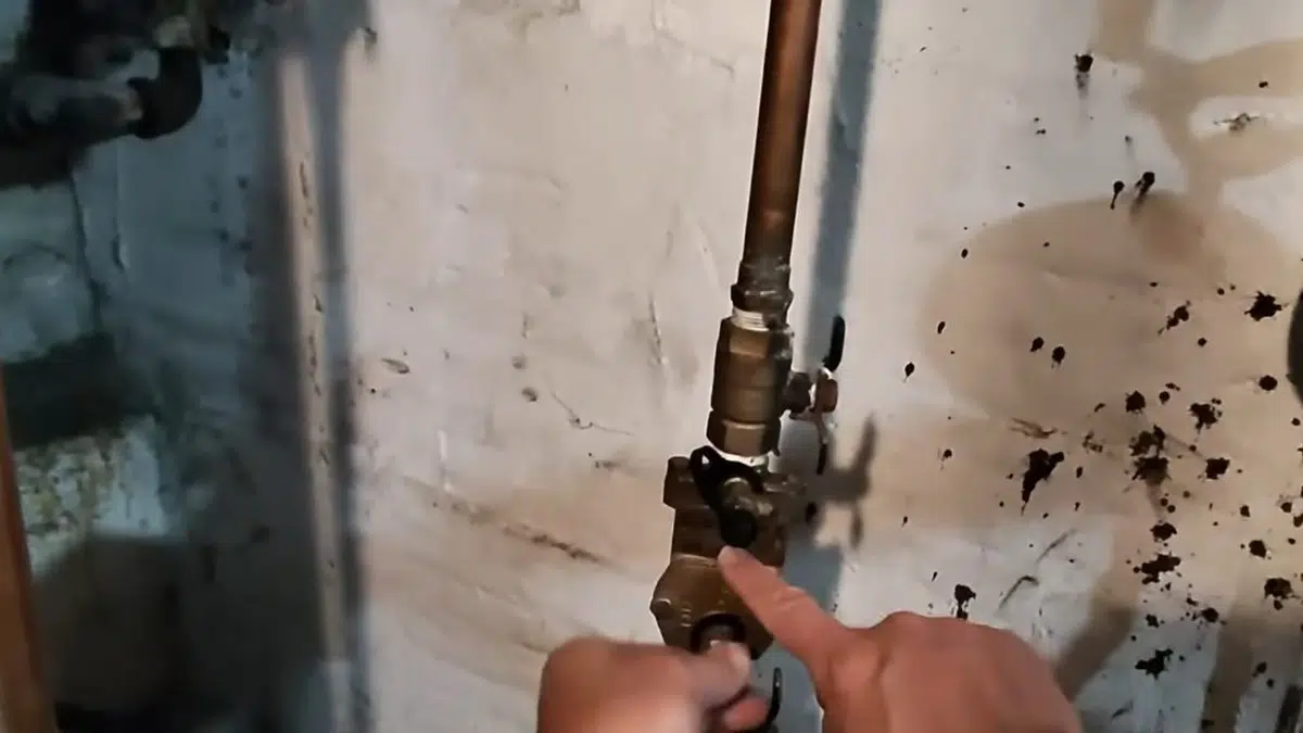 Certified tester working on backflow prevention assembly for backflow testing stanton annual requirements in Stanton