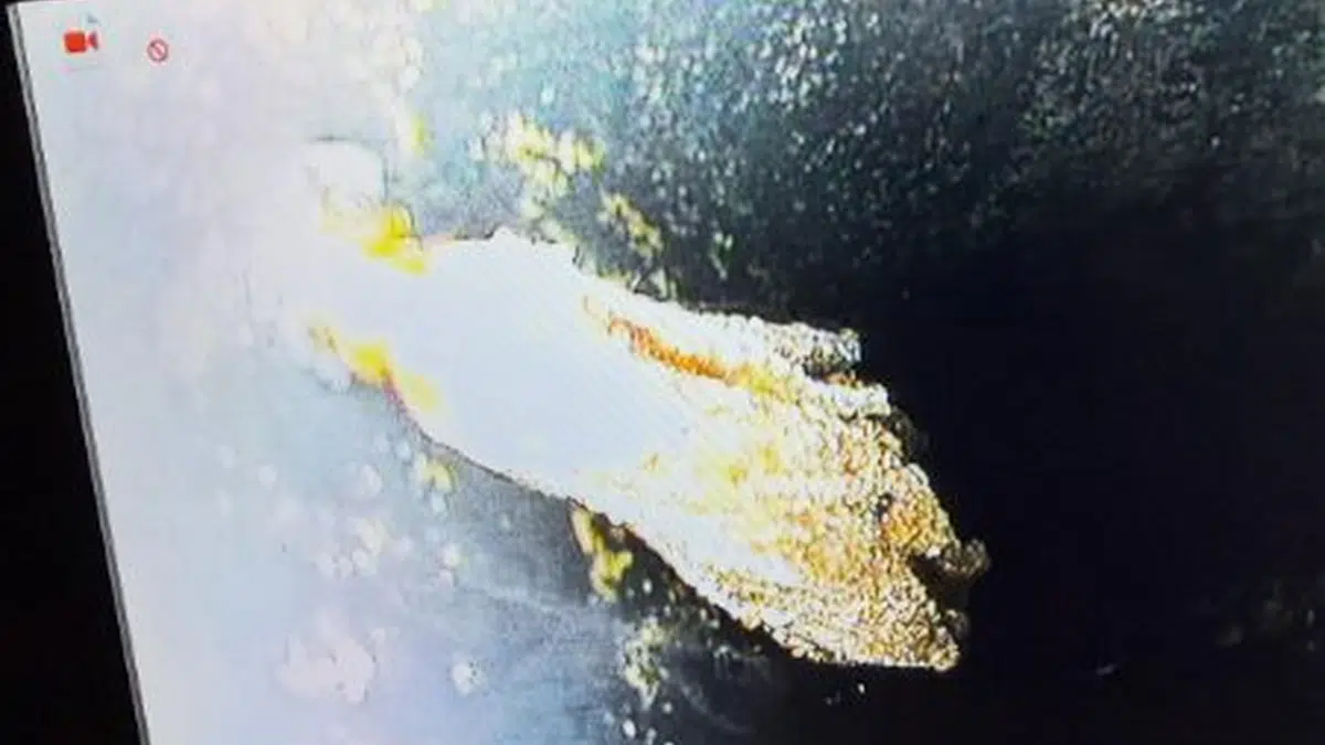Camera monitor showing debris or root mass in sewer pipe for sewer line repair in Stanton