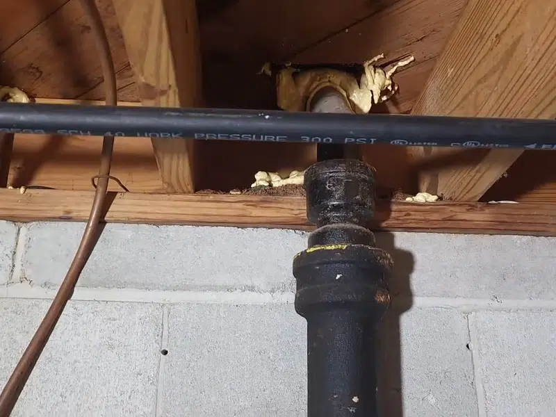 Corroded cast iron drain pipe section with heavy interior buildup for signs your stanton home hasst iron drain problems in Stanton