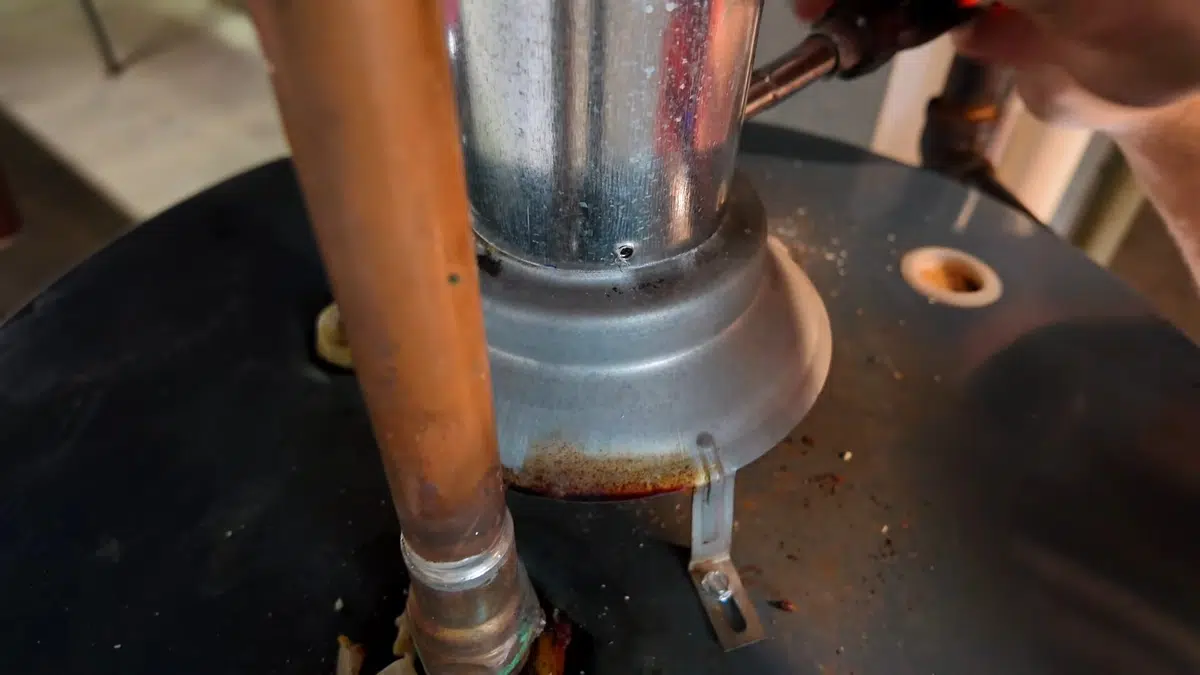 Corroded water heater top around copper inlet pipe for rental property water heater requirementslifornia in Stanton