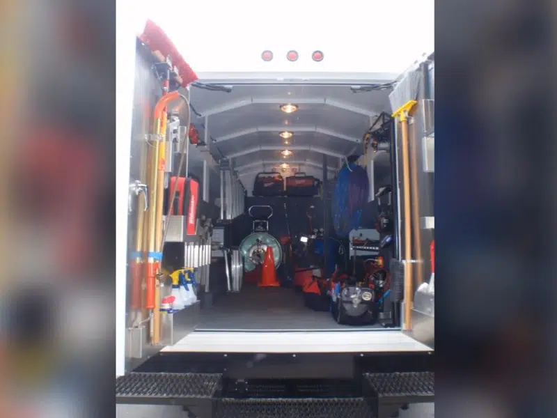 Service truck cargo area with plumbing tools for about page in Stanton