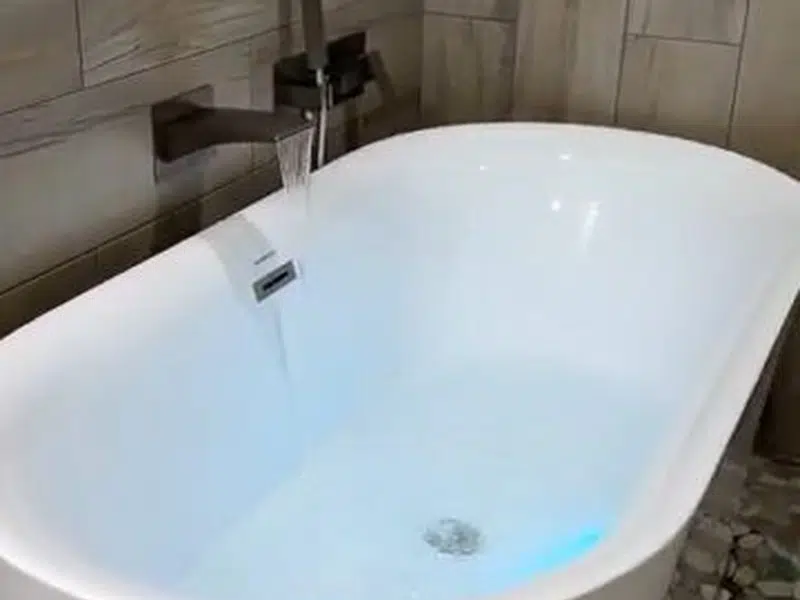Freestanding bathtub in remodeled bathroom for shower bathtub installation in Stanton