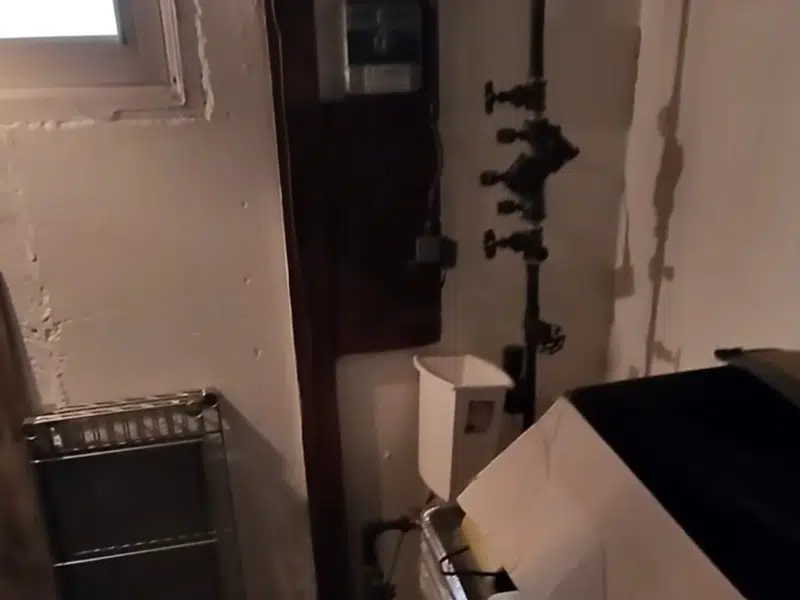 Commercial backflow preventer beside indoor wall for home page in Stanton