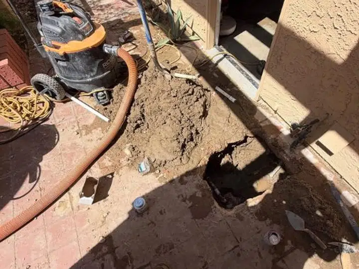 Hidden leak detection equipment and exposed pipe access for leak detection in Stanton
