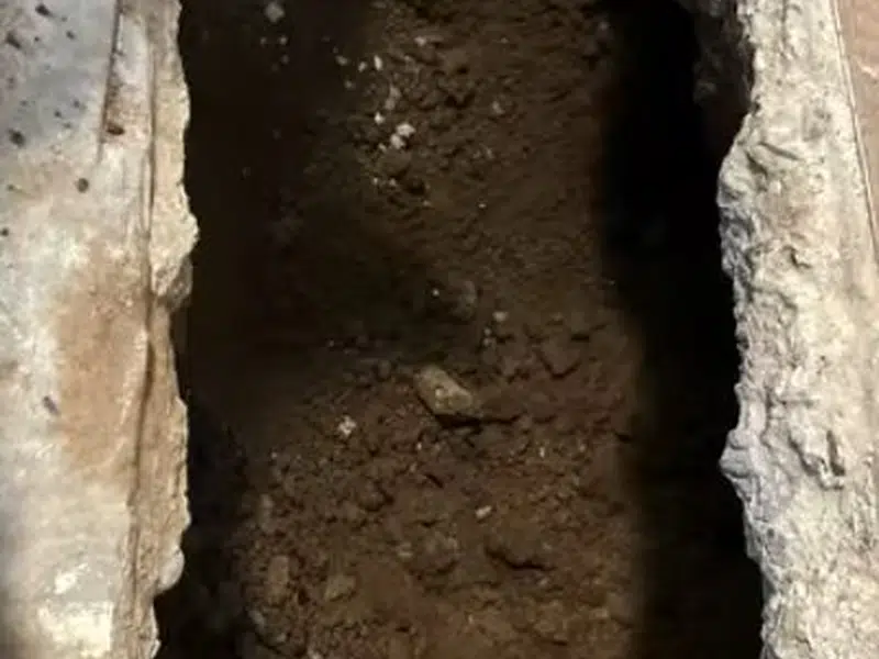 Narrow trench cut for sewer repair access for westminster in Westminster