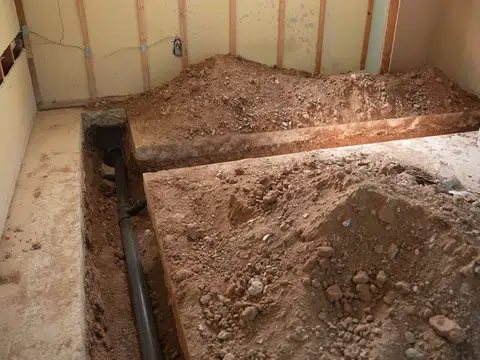 Interior floor opened for underground pipe repair for plumbing blog index in Stanton
