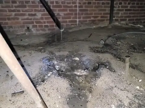 Opened floor and framing showing leak-damaged subfloor for plumbing blog index in Stanton