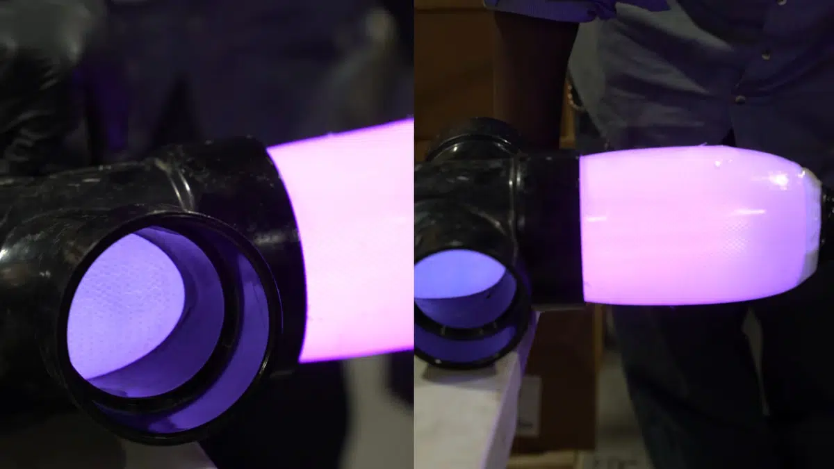 Purple-lit pipe opening showing jetting or lining equipment inside for drain cleaning unclogging in Stanton