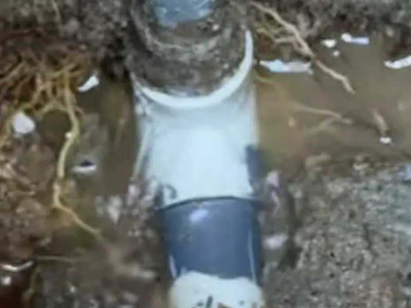 New pvc sewer repair coupling in excavated soil for tina park area in Tina Park Area, Stanton