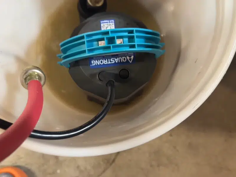 Submersible pump inside bucket for tankless flushing for tankless water heater in Stanton