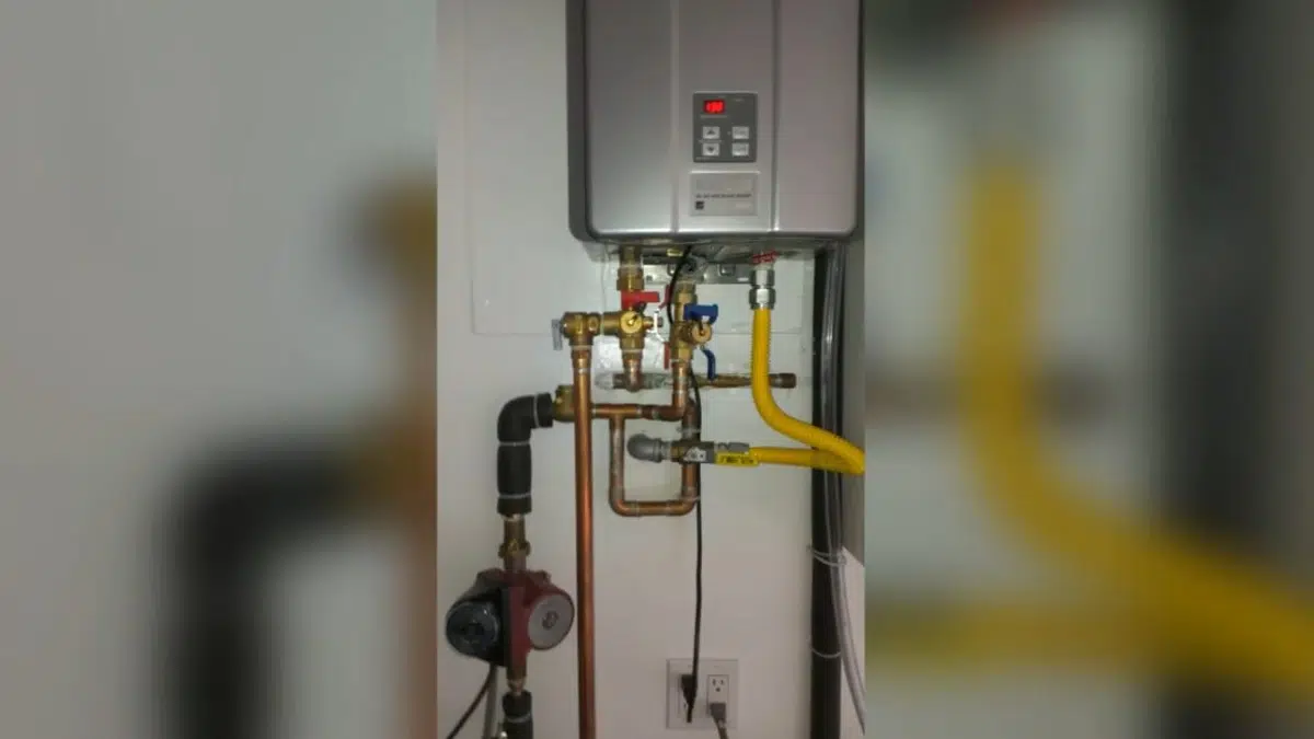 Tankless water heater with gas and water connections for tankless water heater in Stanton