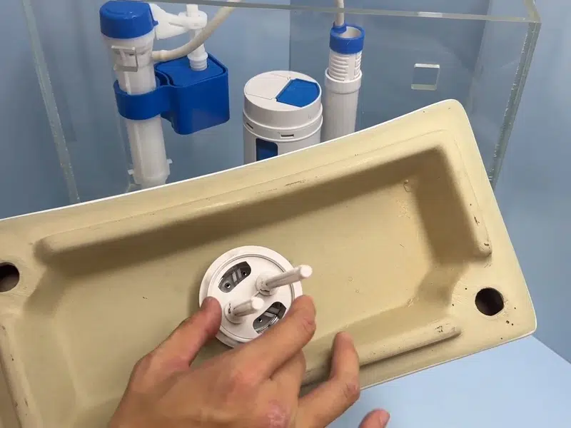 Toilet tank repair parts and flush valve assembly for toilet repair installation in Stanton shown from a different service angle