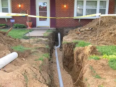 Front yard trench with sewer pipe access near home for plumbing blog index in Stanton