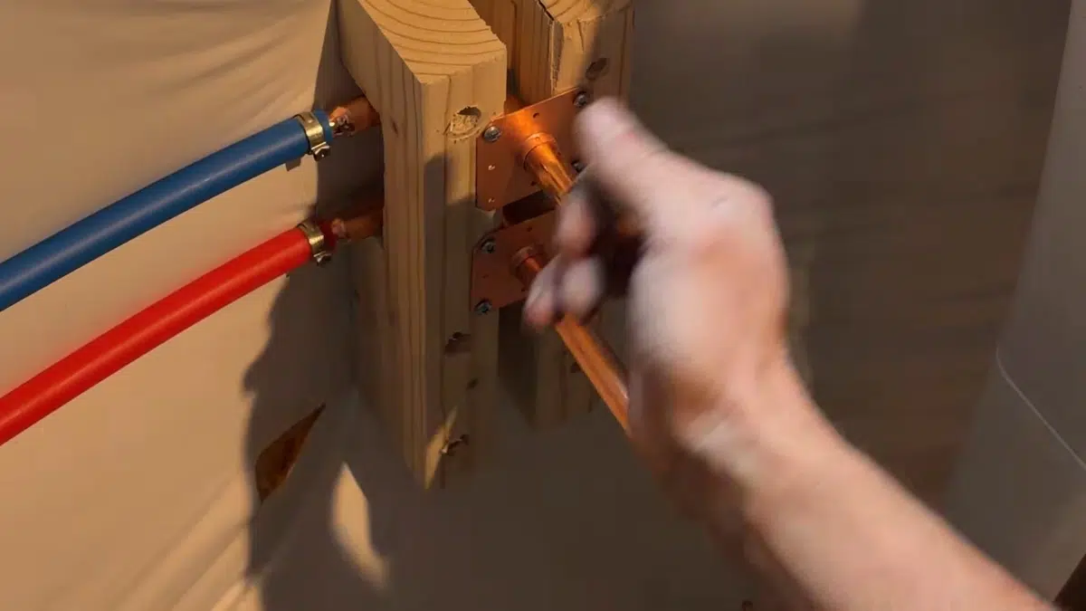 Pex supply lines being attached through wall for utility sink for hose bib outdoor faucet in Stanton