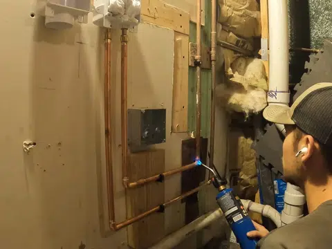 Plumbing repair work area with exposed pipe and tools for index in Stanton for thumb loc magnolia street area 001